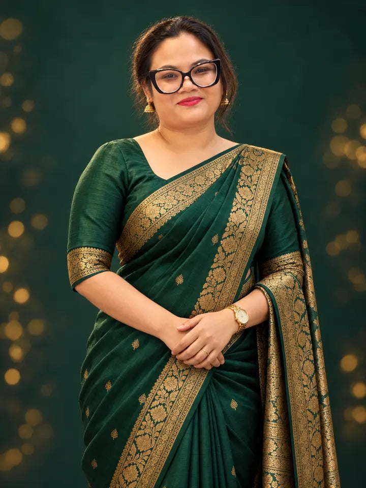 Festive campaign portrait in an emerald and gold saree